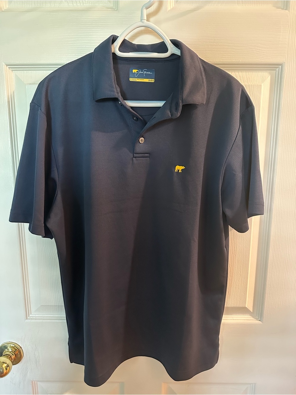 Jack Nicklaus Navy Polo with Yellow Bear Logo - Size Medium